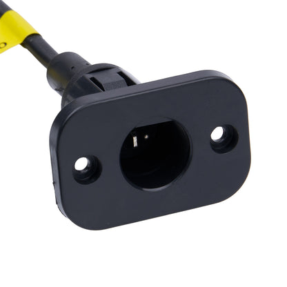 Black electrical outlet with yellow cord on a white background