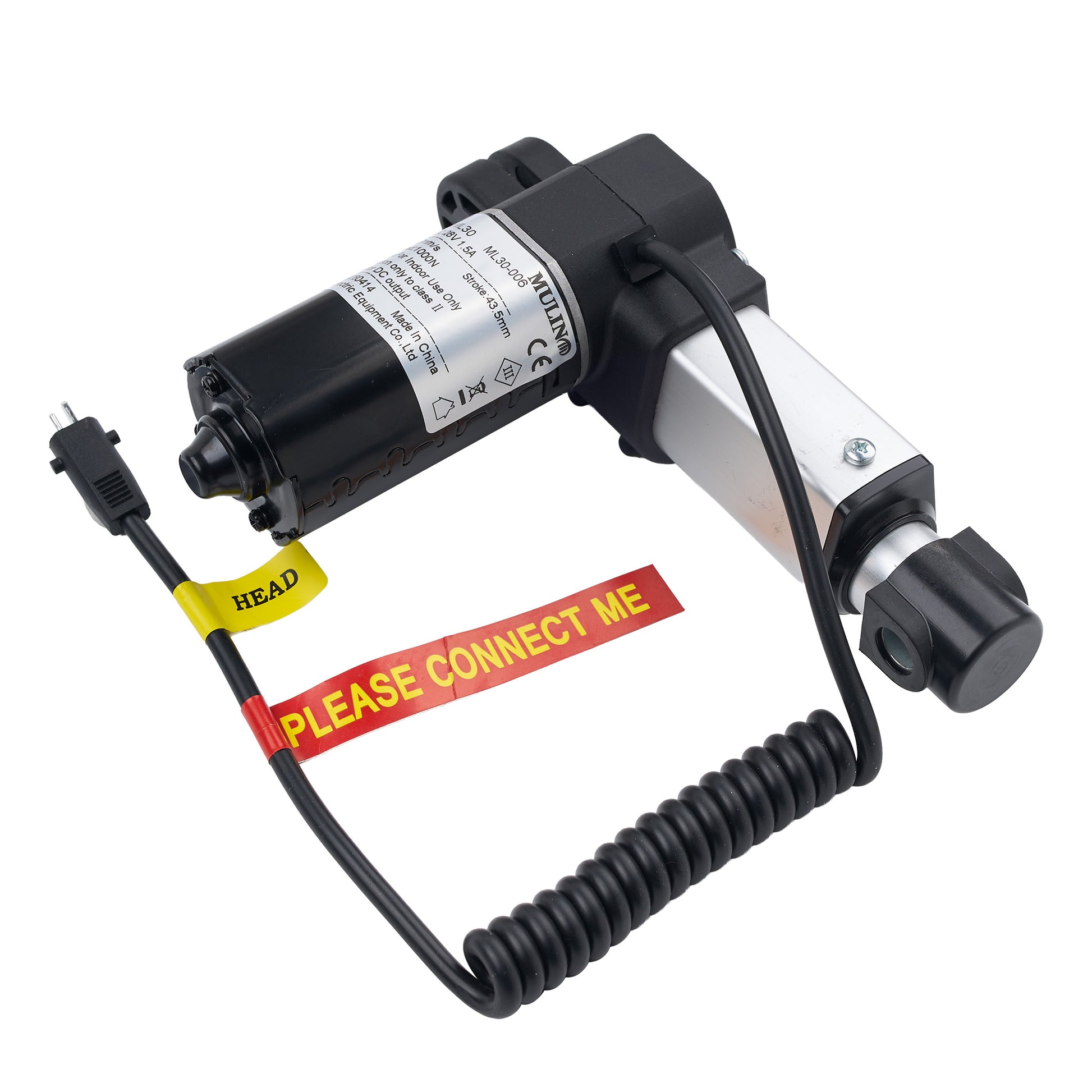A black and silver linear motor with a black coiled cable, yellow head cable tie, and red 'PLEASE CONNECT ME' warning label, shown on a white background.
