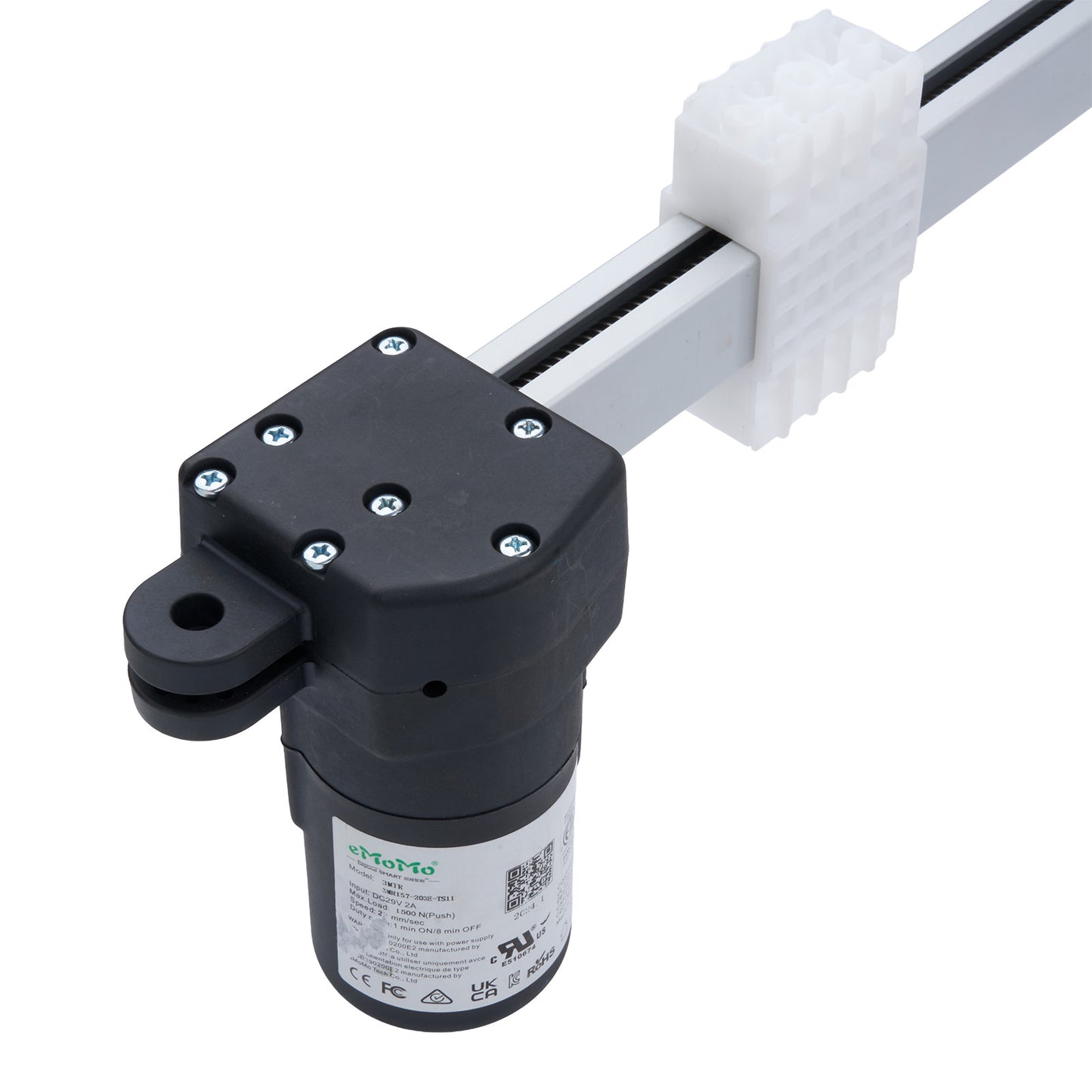 Black cylindrical device with a white label on a white background