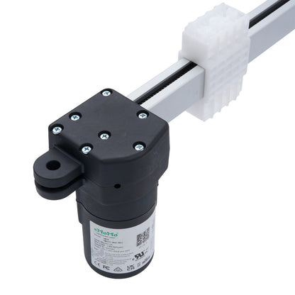 Black cylindrical device with a white label on a white background