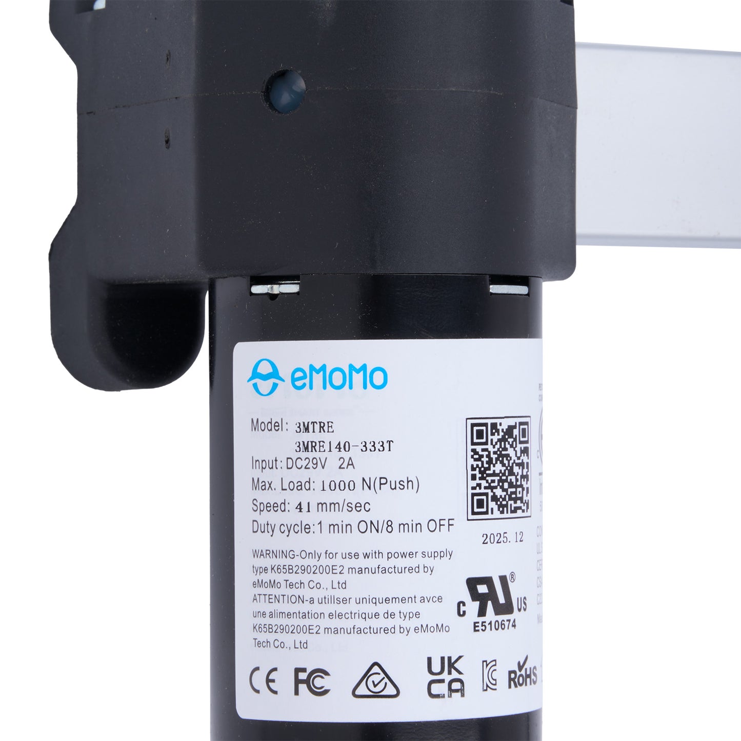 Close-up of a device with emomo branding and technical specifications on a white background