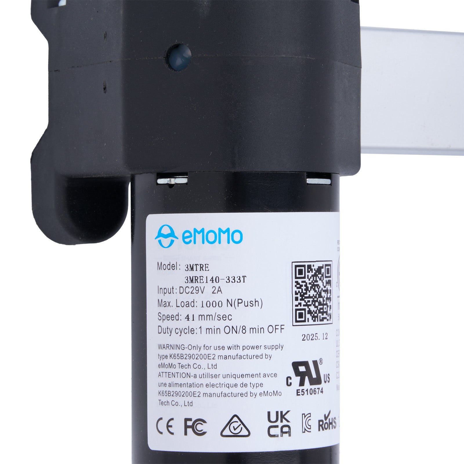 Close-up of a device with emomo branding and technical specifications on a white background