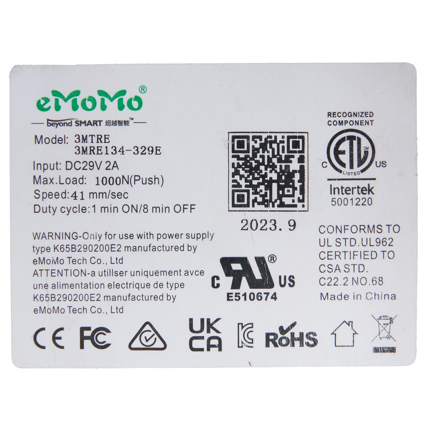 Technical label with eMoMo branding and certification logos on a white background