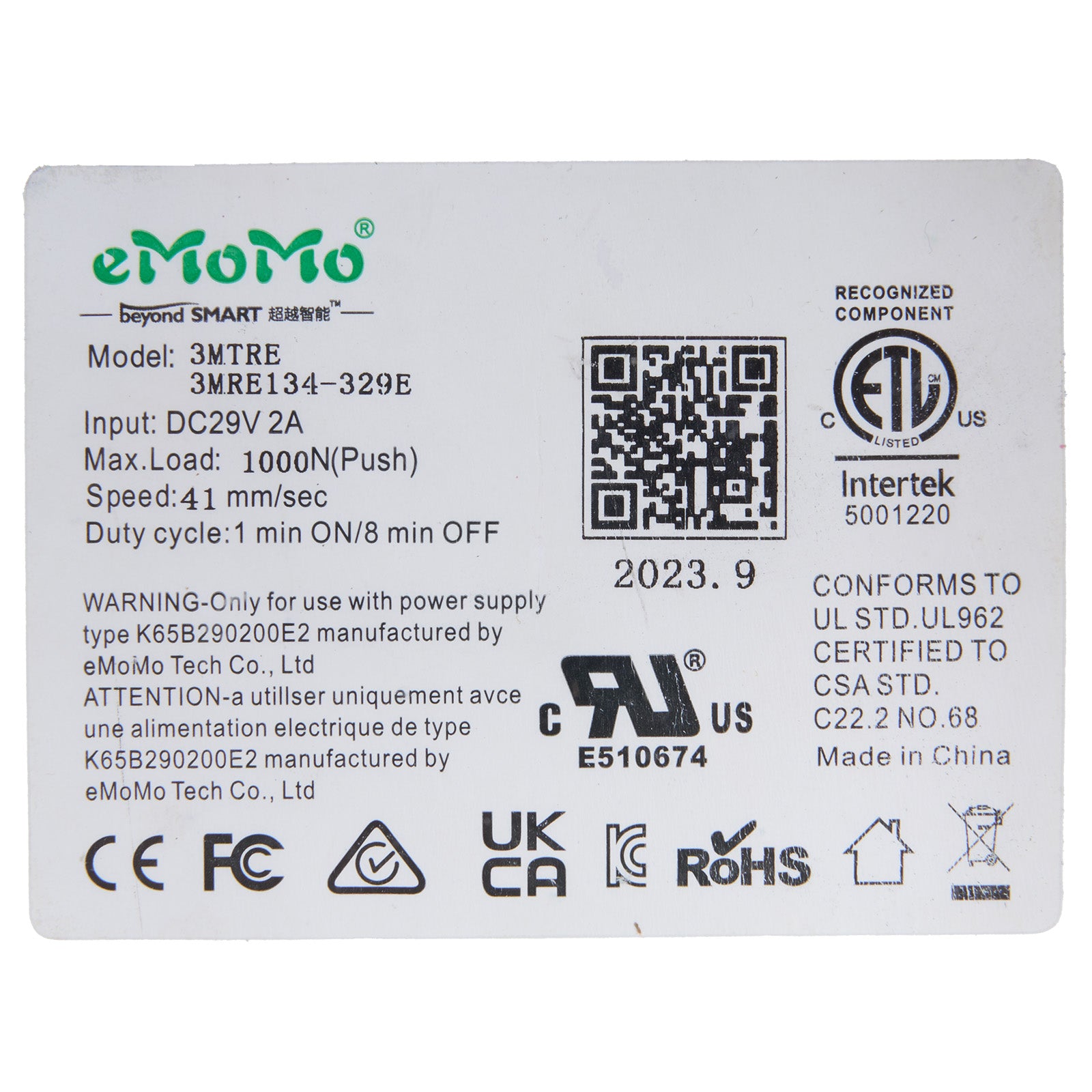 Technical label with eMoMo branding and certification logos on a white background