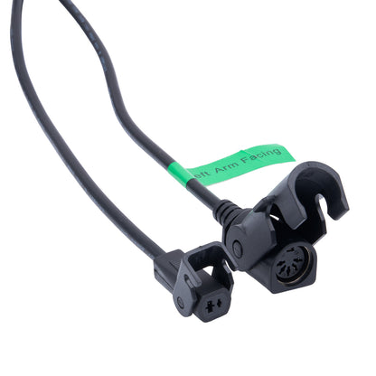 Black sensor cable with green label on a white background
