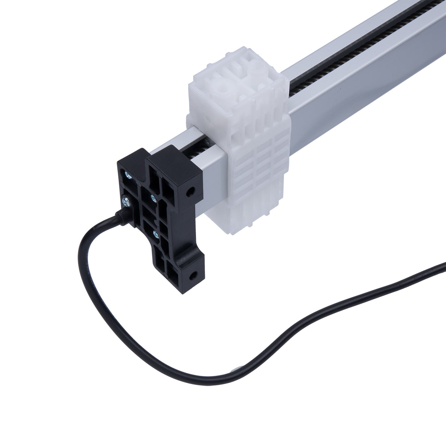 Close-up of a white electronic component with black wiring on a white background