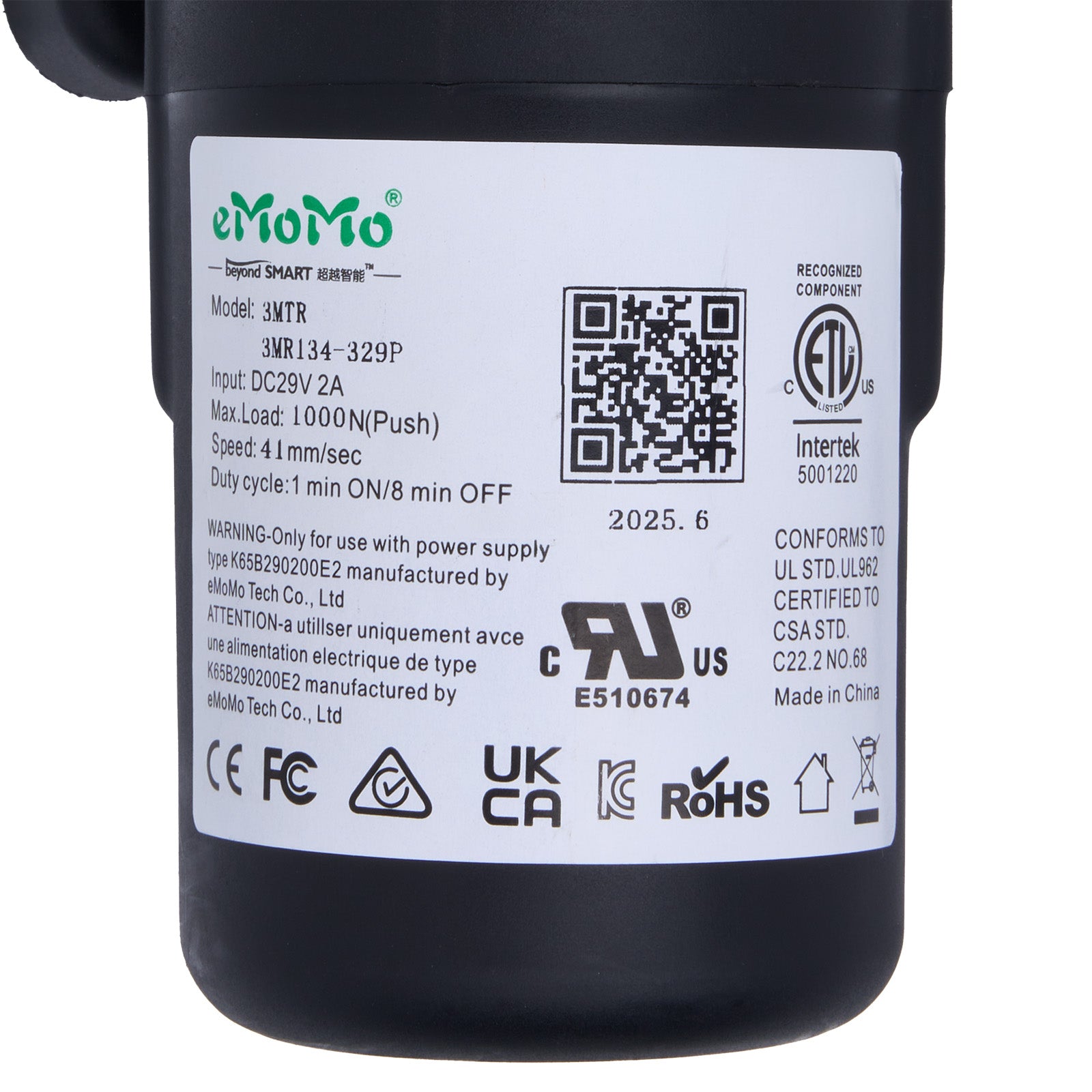 Black device with a label containing text, symbols, and a QR code on a white background