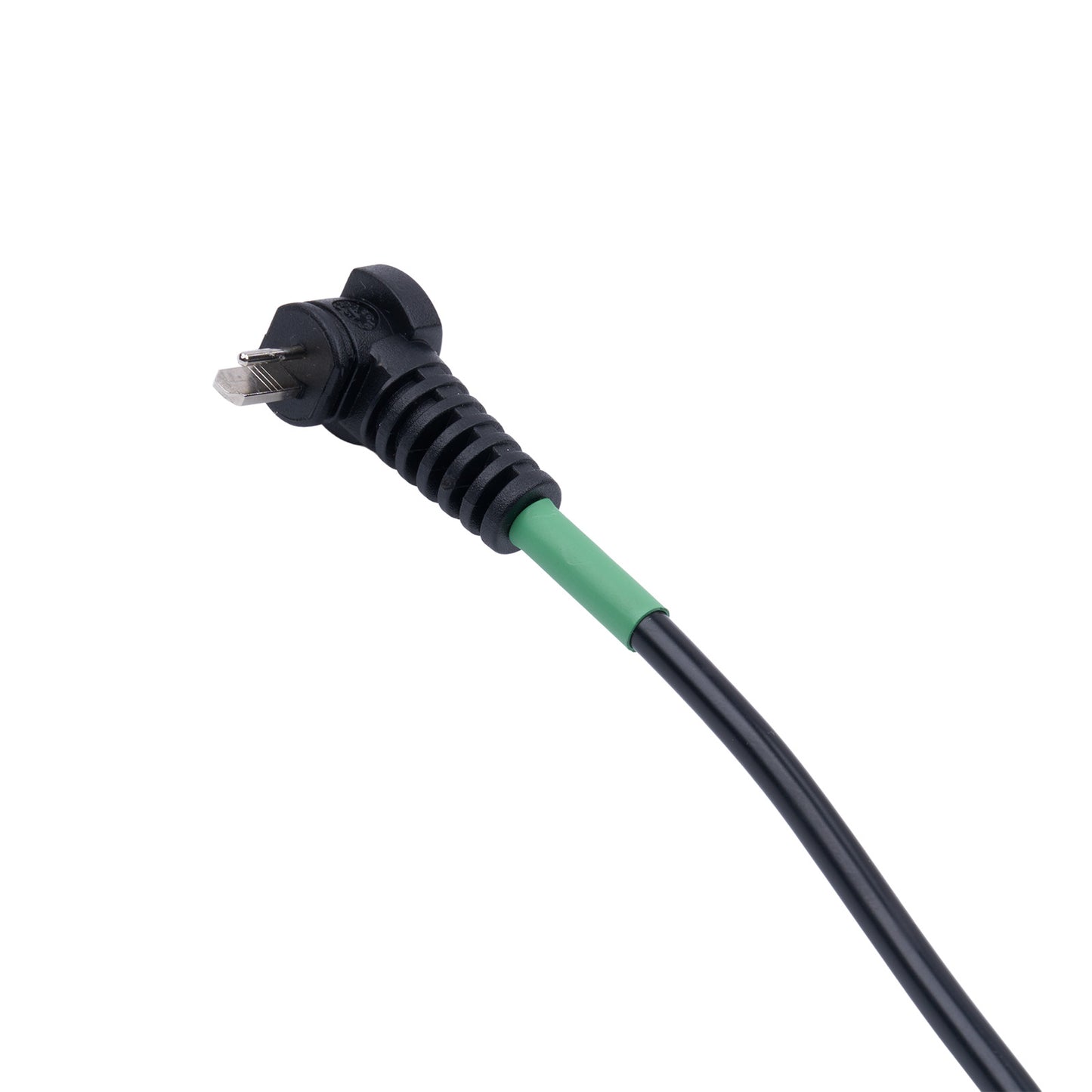 Black electrical plug with green connector on a white background