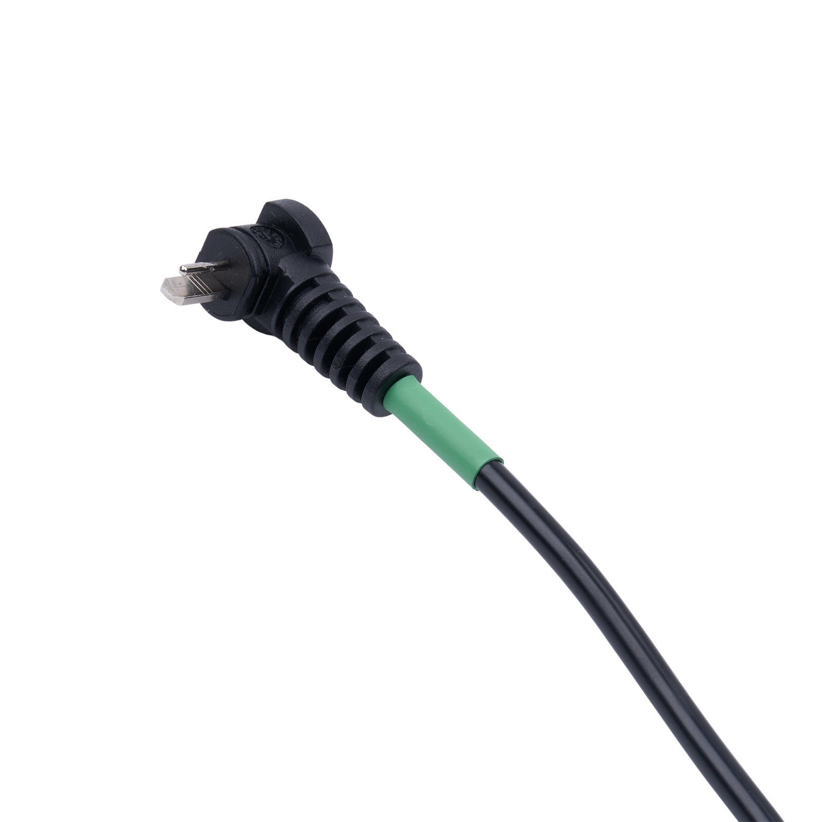 Black electrical plug with green connector on a white background