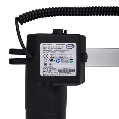 Black motor actuator with coiled cable on a white background