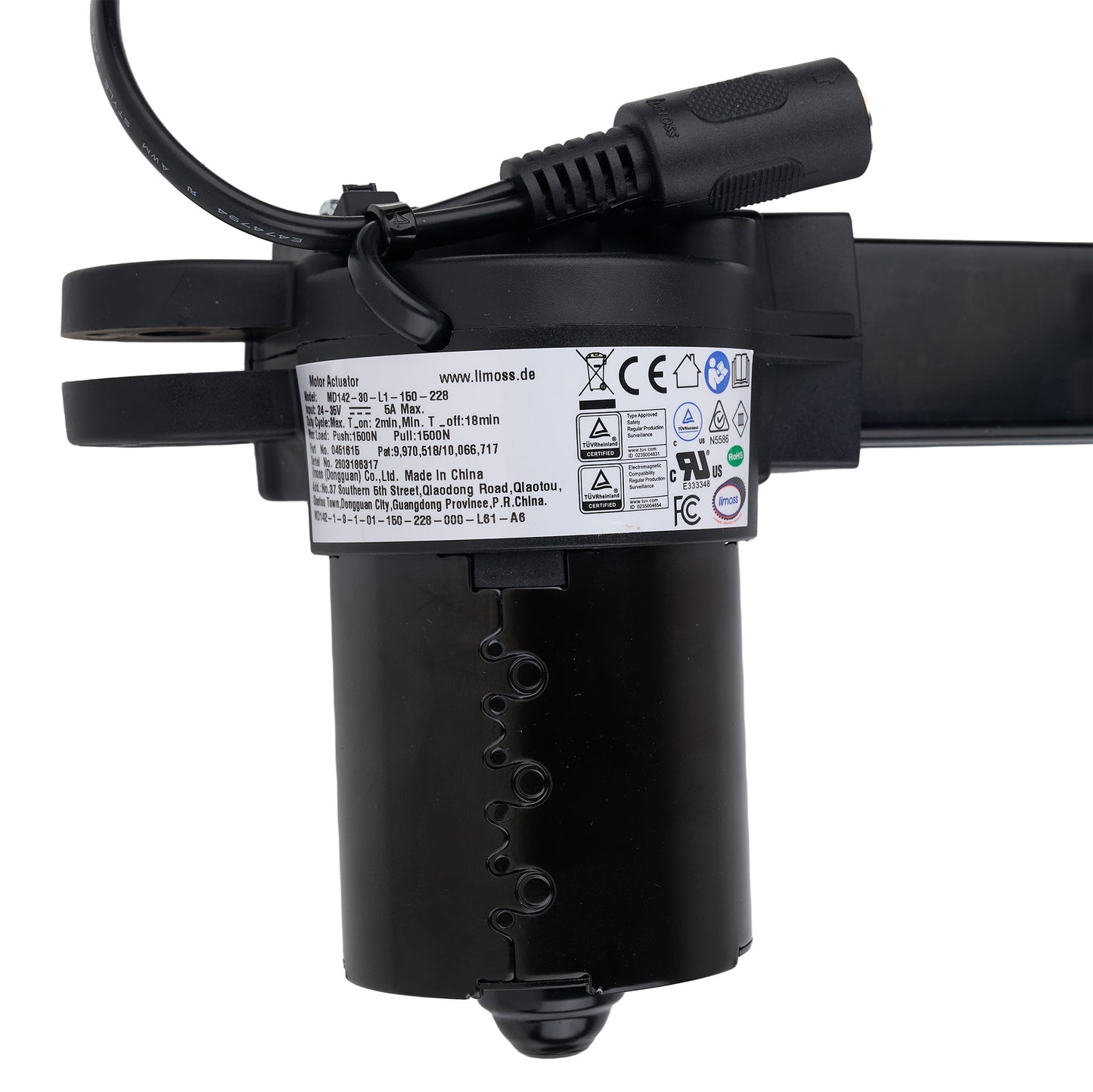 Black electronic device with label and cable on a white background