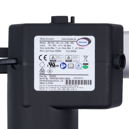 Black actuator with a label on a white background