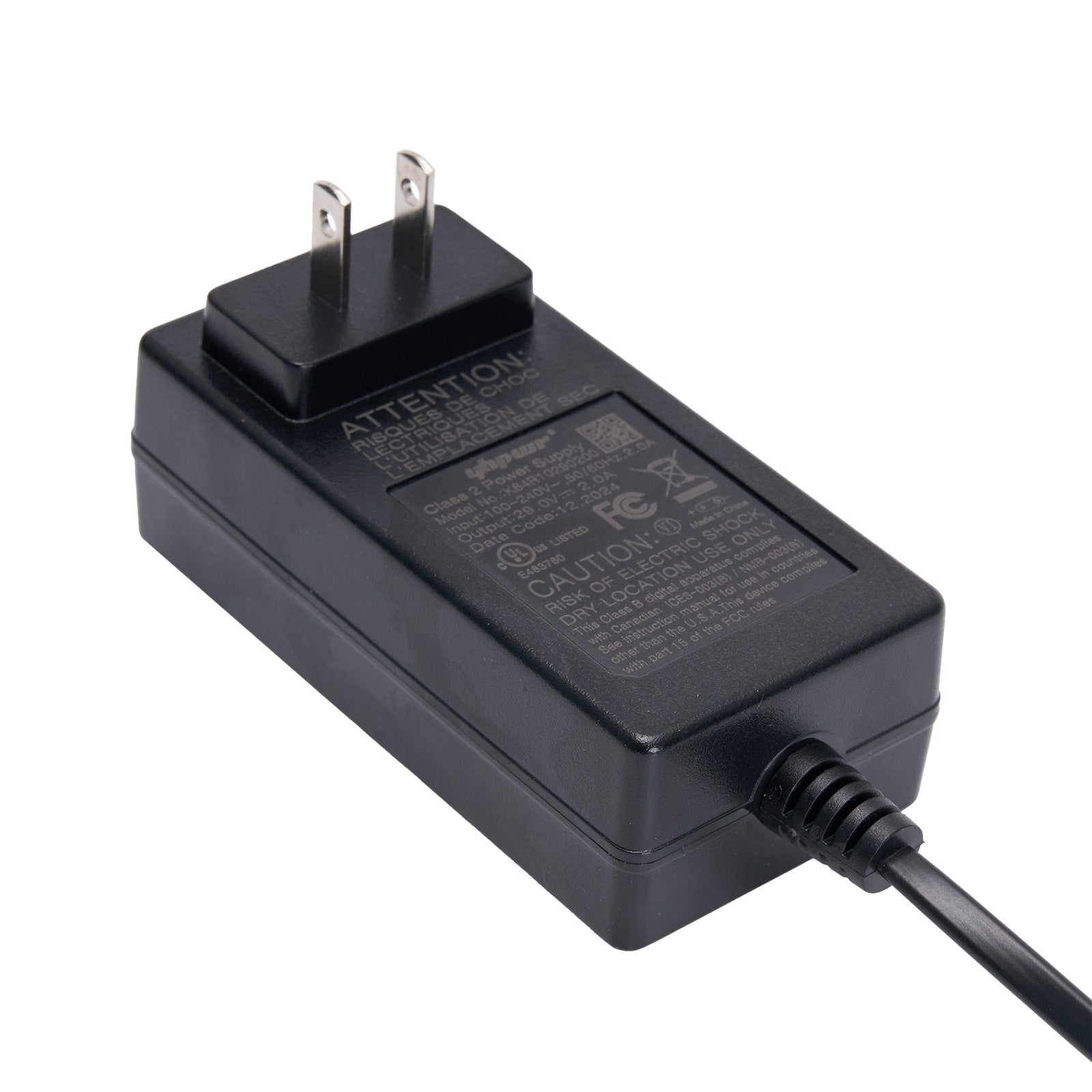 Black power adapter with plug on a white background