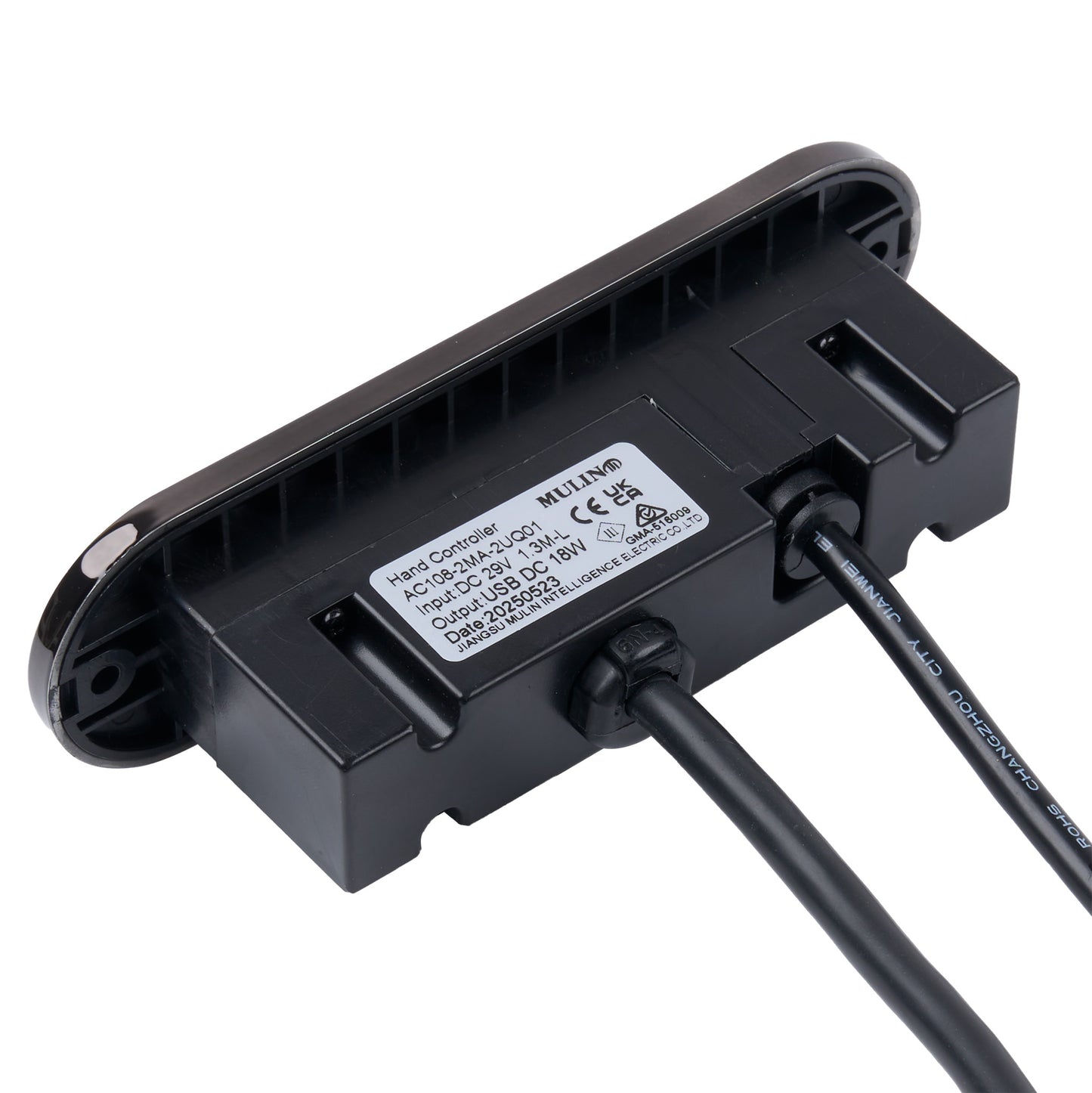 Black electronic component with cables on a white background