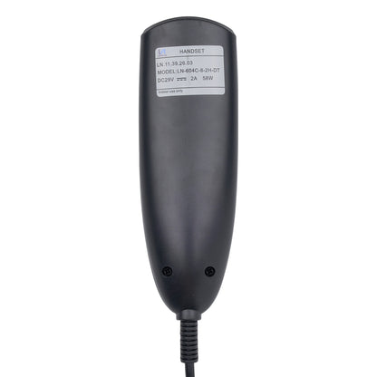 A black industrial handset controller with a white label showing technical specifications, photographed against a solid white background.