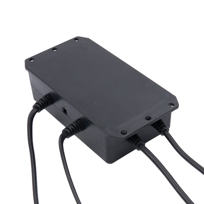 A black plastic electronic control box with screw terminals on the top and side, connected to black cables, shown on a plain white background.