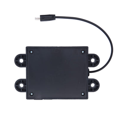 Black electronic module with wires on a white background