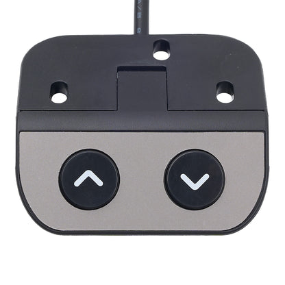 Close-up of a golf putter head with two buttons on a white background