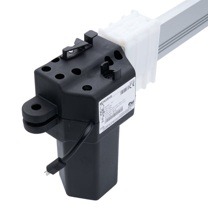 Black mechanical component with a white rod on a white background