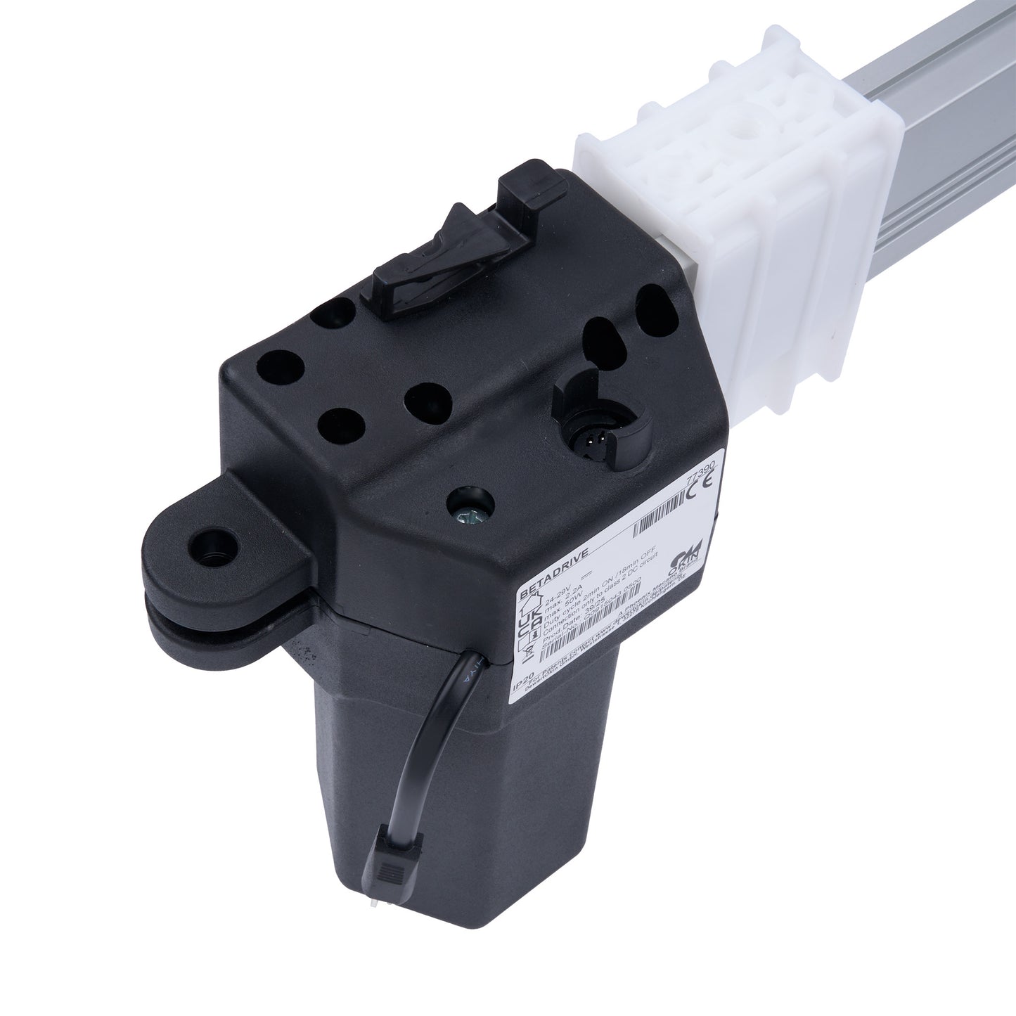 Black mechanical component with a white cable on a white background