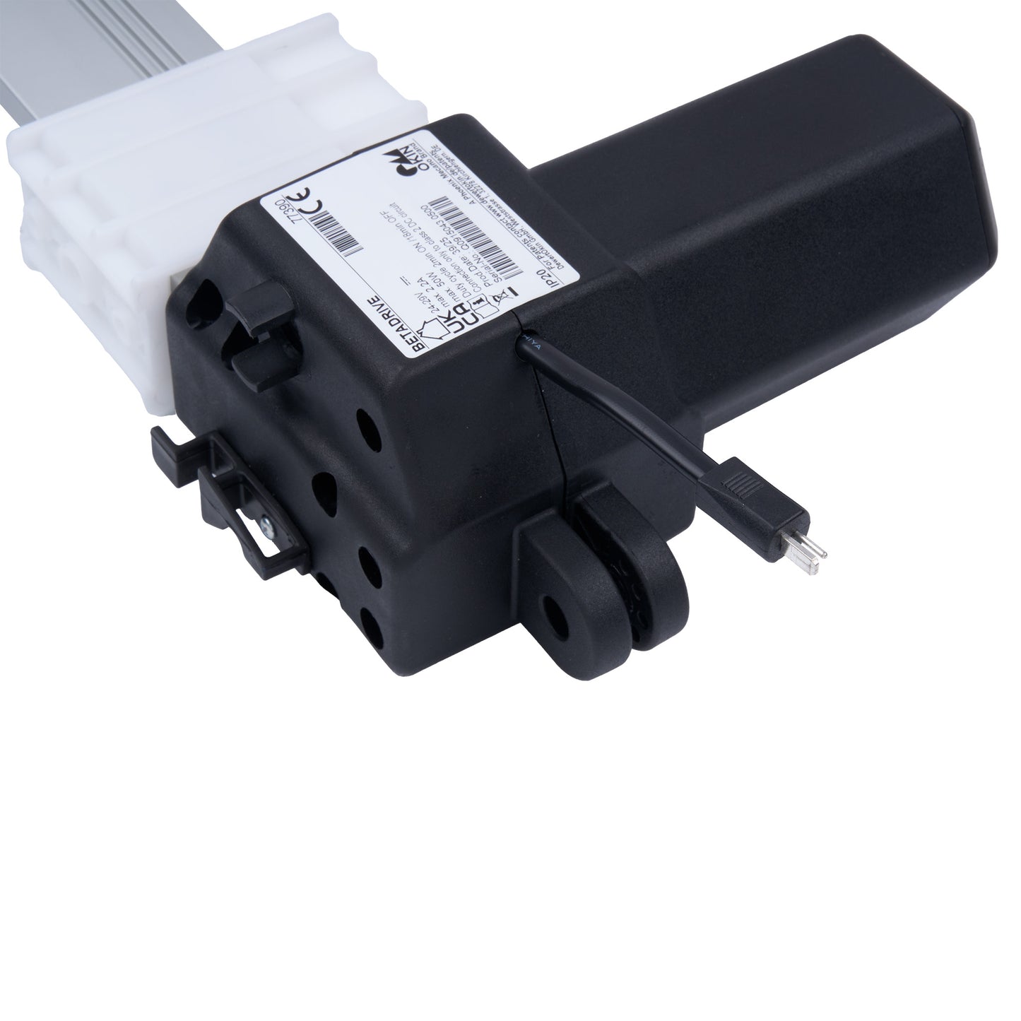 Black mechanical component with white label on a white background