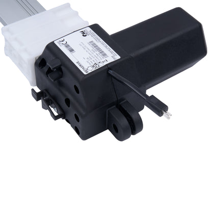 Black mechanical component with white label on a white background