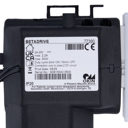 Black electronic component with label on a white background