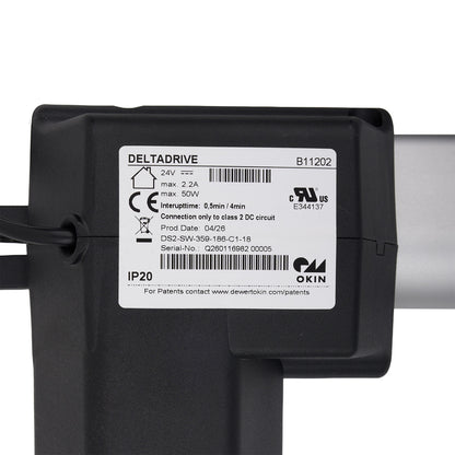 Mechanical component with a white bar and black housing on a white background