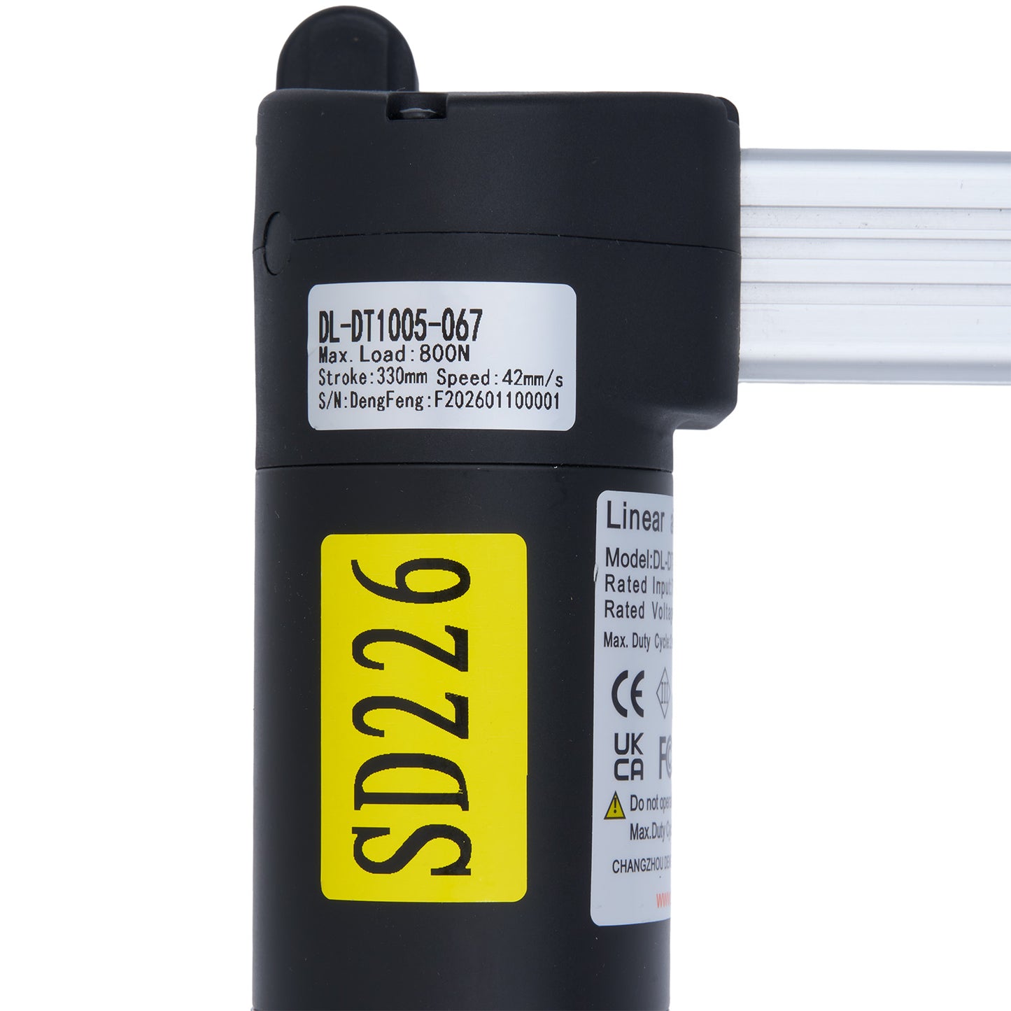 Black linear actuator with yellow label and text on a white background