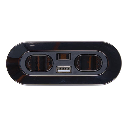 Black electronic device with two ports and a USB connector on a white background