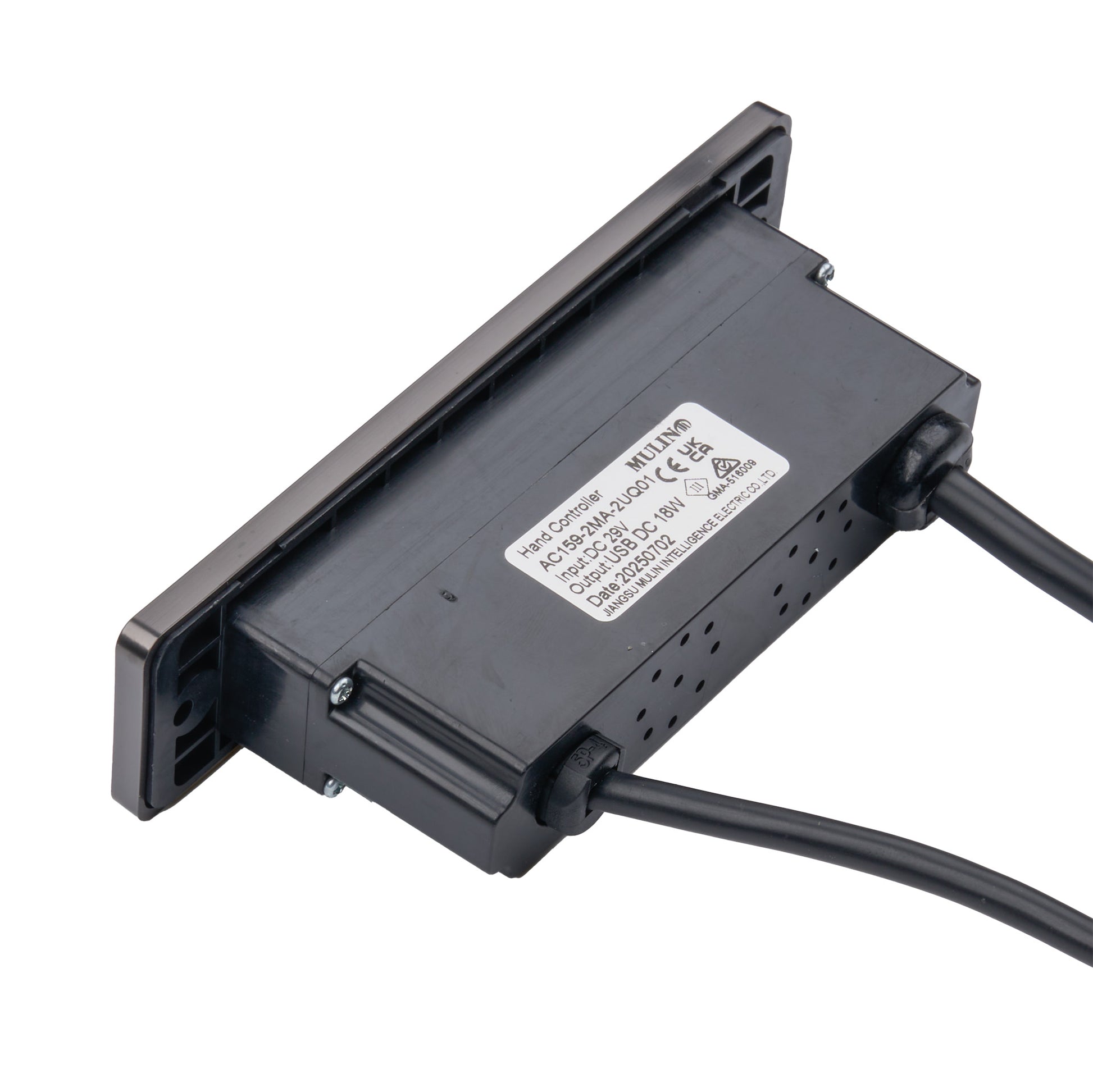 A black industrial electronic module with a white product label, shown at an angle with two attached black cables on a plain white background.