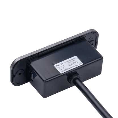 A black plastic electronic sensor or switch module with a rectangular mounting plate, a small white product label, and a black cable extending from the front, shown on a plain white background.