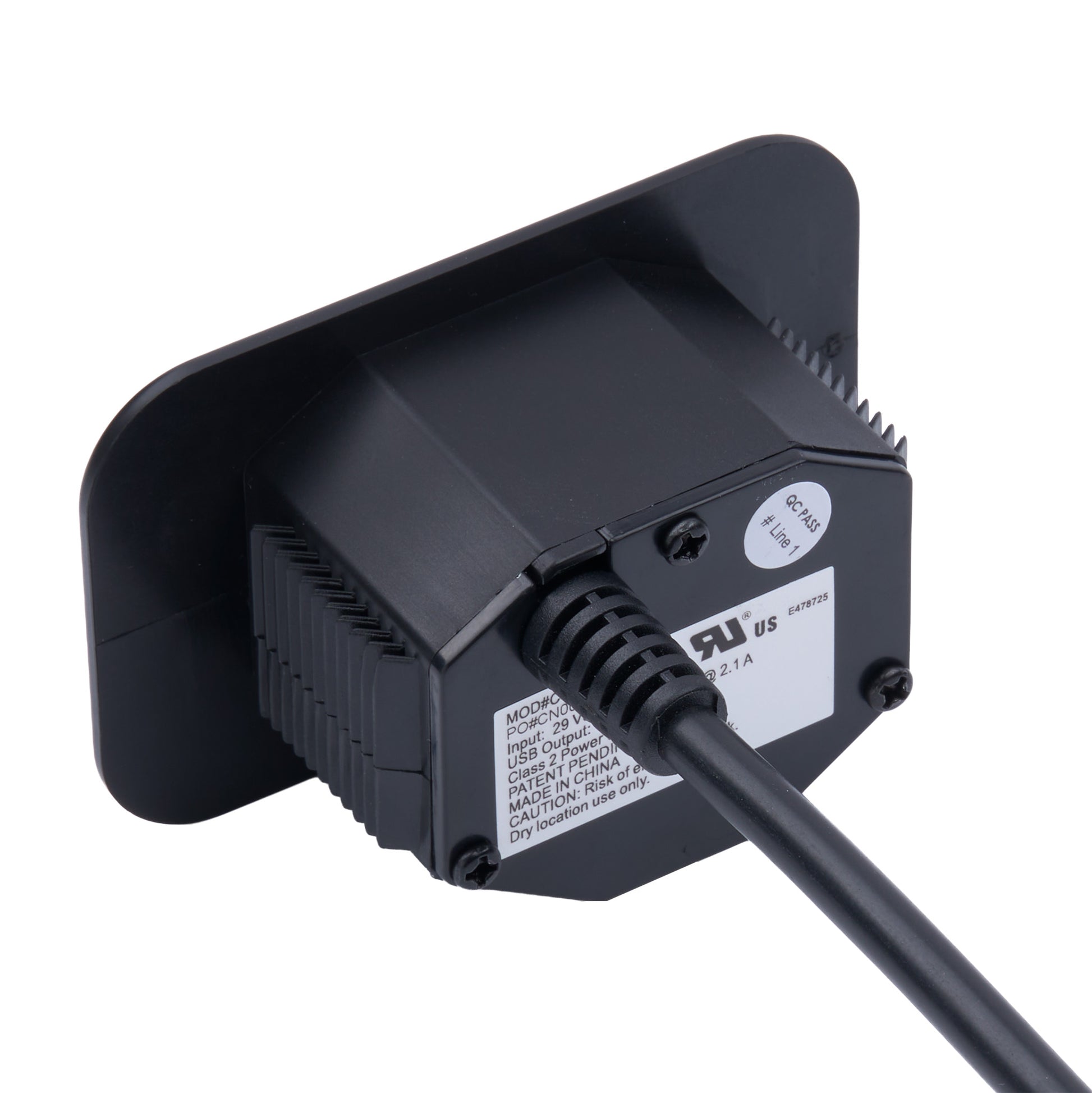 Black electronic sensor or adapter with a ribbed housing, a flat mounting plate, a power cord, and a ULus certification sticker on a white background.