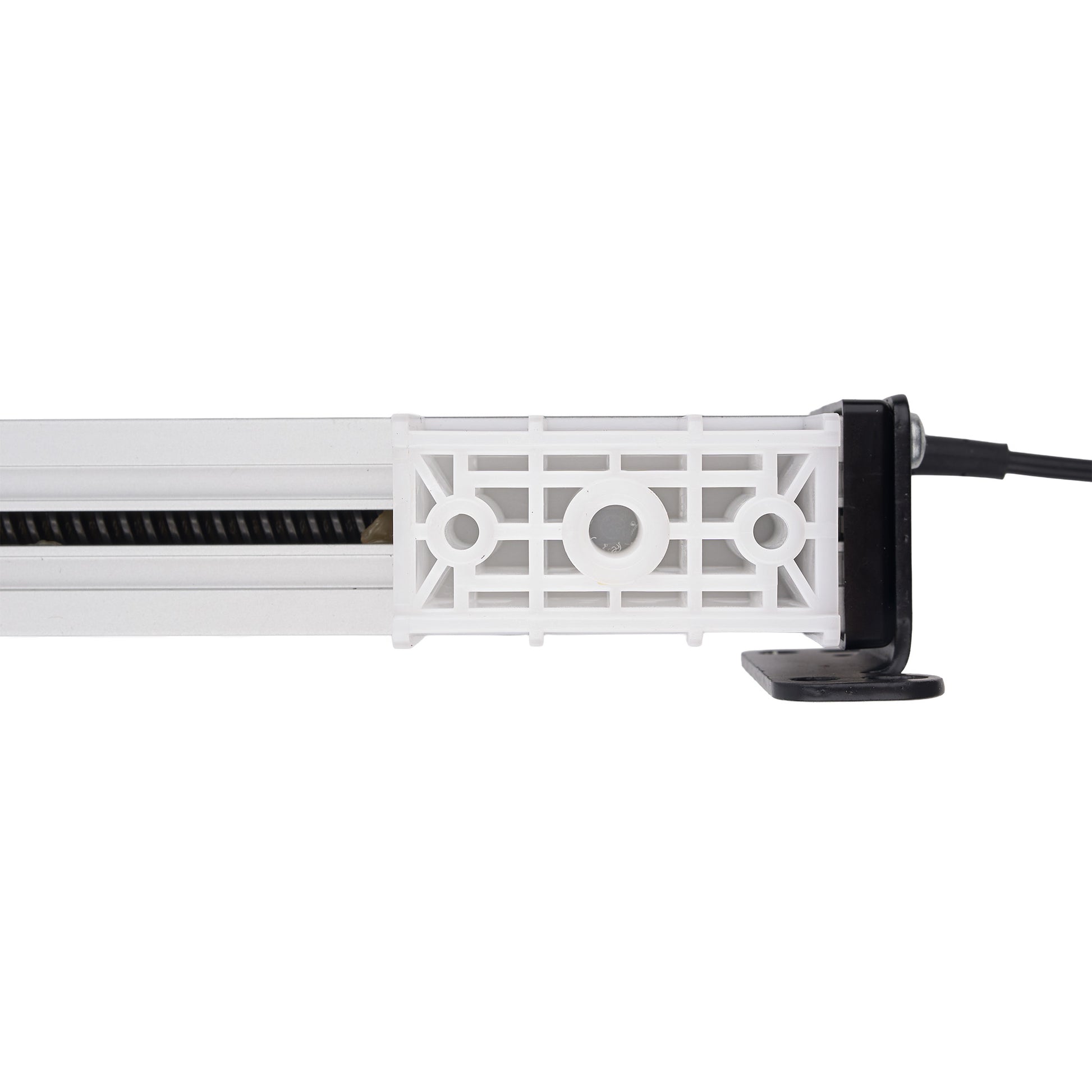 A close-up side view of a white plastic linear light fixture with a black power cord connected to a black terminal, shown against a plain white background.