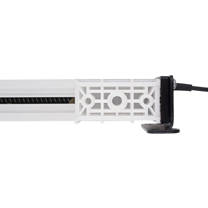 A close-up side view of a white plastic linear light fixture with a black power cord connected to a black terminal, shown against a plain white background.