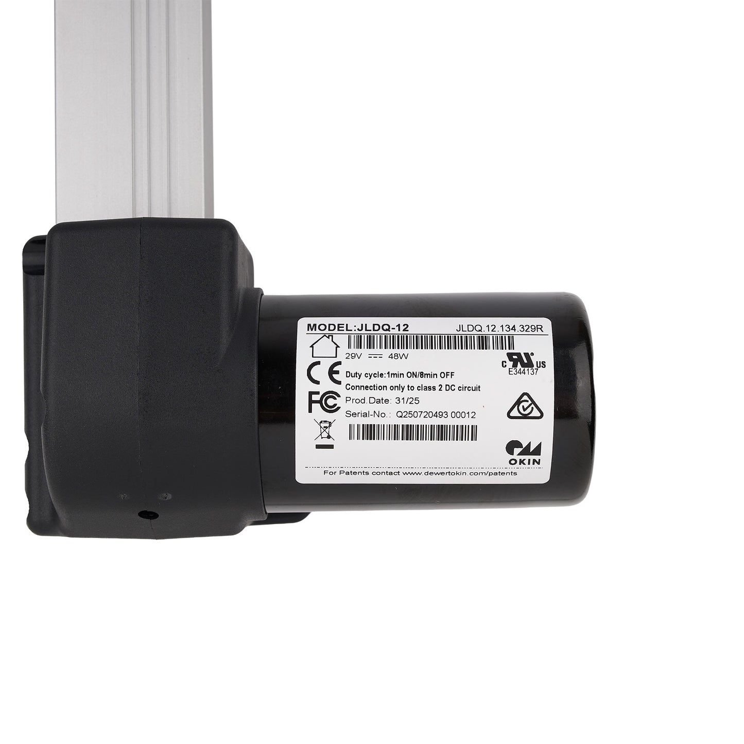 Black mechanical component with a label on a white background