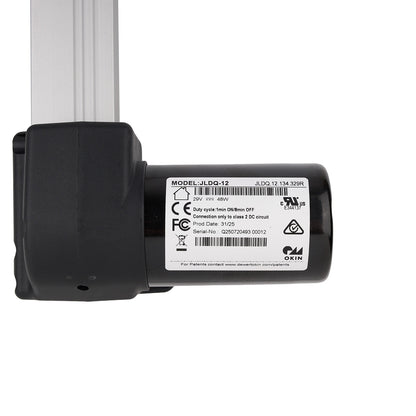 Black mechanical component with a label on a white background