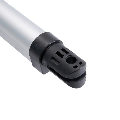 Close-up of a metallic and black cylindrical object on a white background