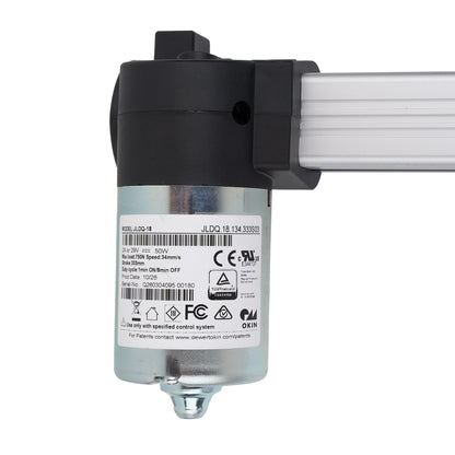Close-up of a mechanical component with labels and certification logos on a white background