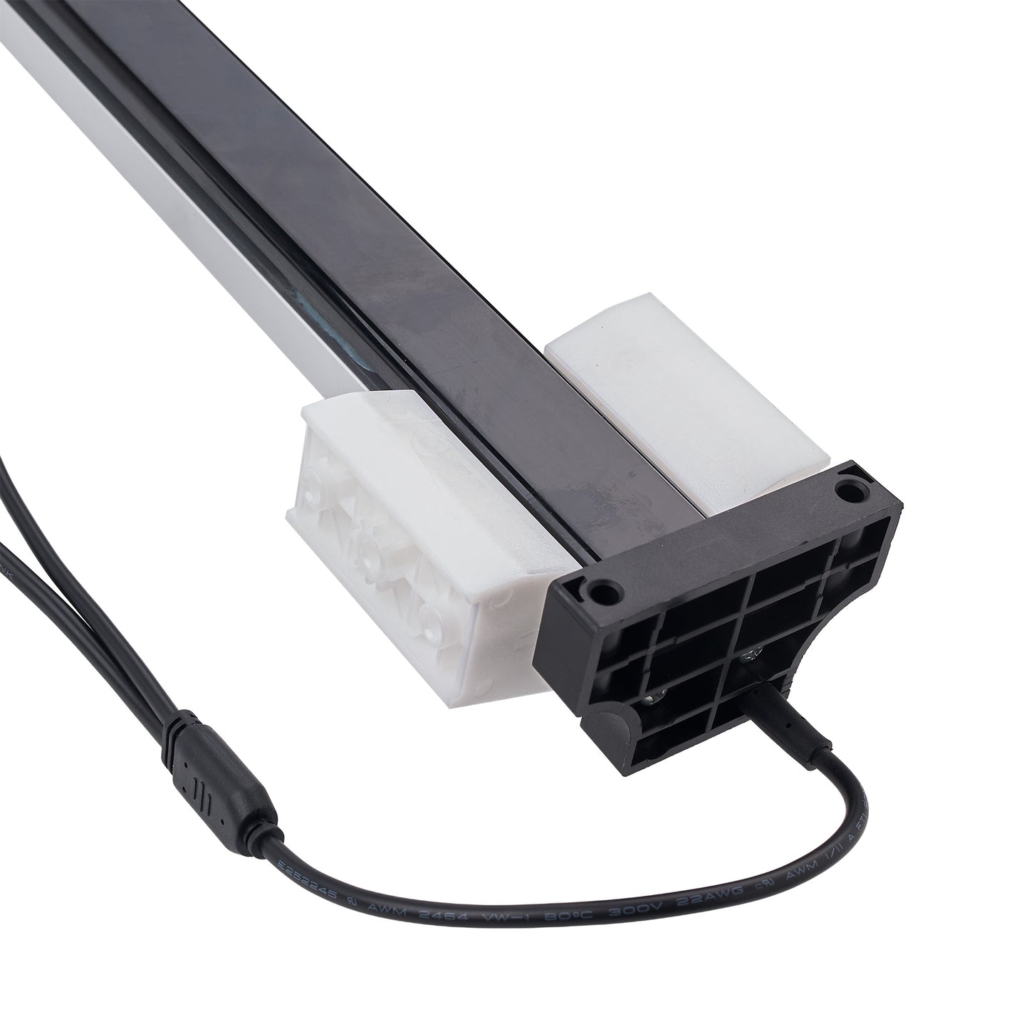 A close-up of a linear light fixture component with a black aluminum rail, white plastic mounting brackets, and a black power connector with attached cable, shown on a white background.