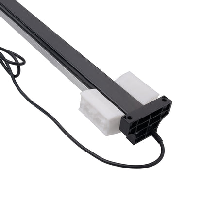 A close-up of a black linear aquarium light fixture with a white diffuser and a black power connector, shown on a plain white background.