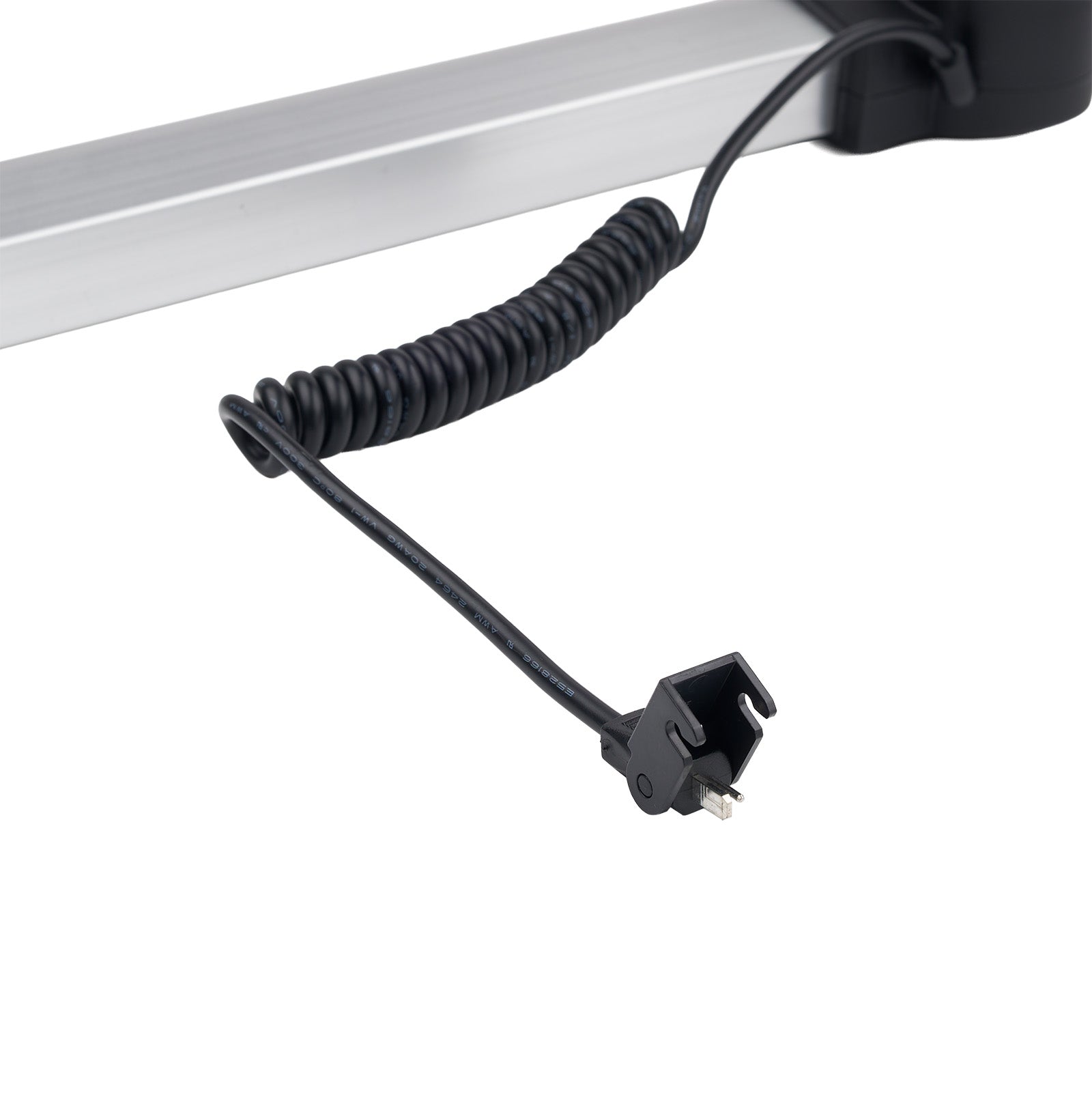 Black coiled cable with a plug on a white background