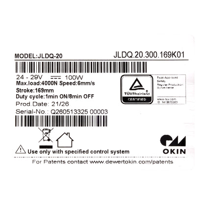 Technical specification label for an Okin JLDQ-20 motor, showing model number JLDQ-20, voltage 24-29V, 100W, and a TÜV Rheinland certification mark on a white background.