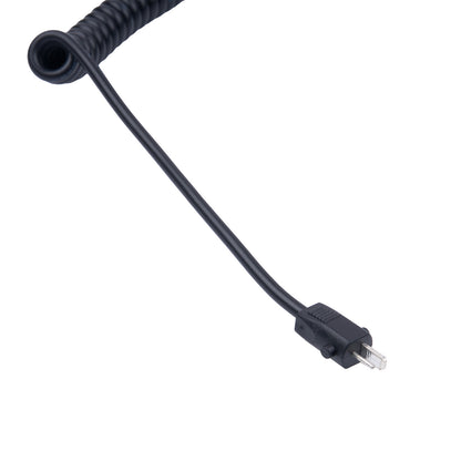 Black coiled cable with a plug on a white background