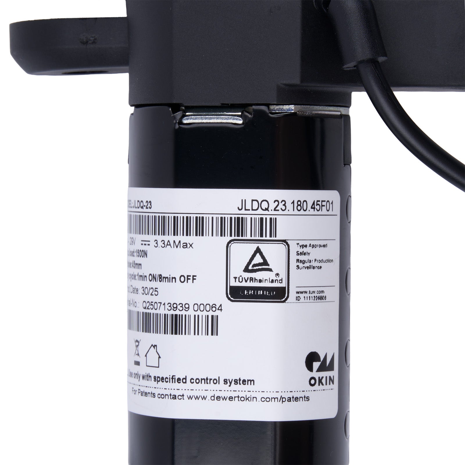 Black cylindrical device with a label on a white background