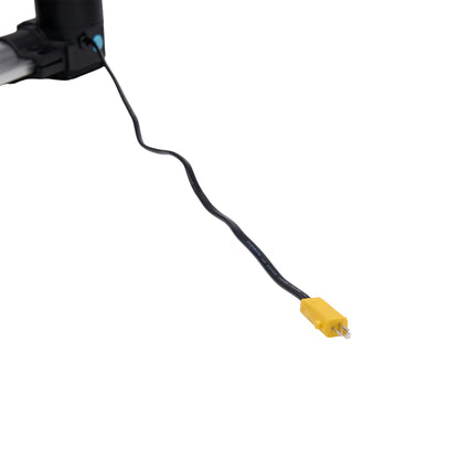 Black cable with a yellow connector on a white background