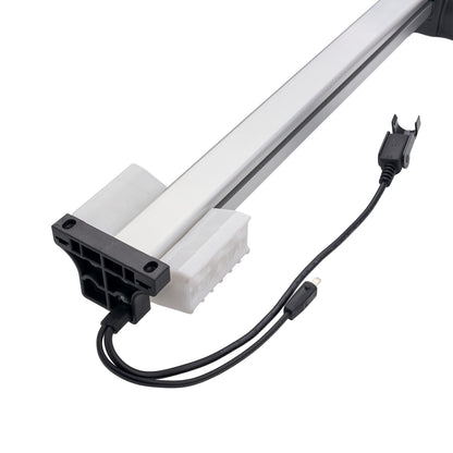 A linear LED light bar with a white aluminum tube, black plastic mounting bracket, and attached power cable on a solid white background.