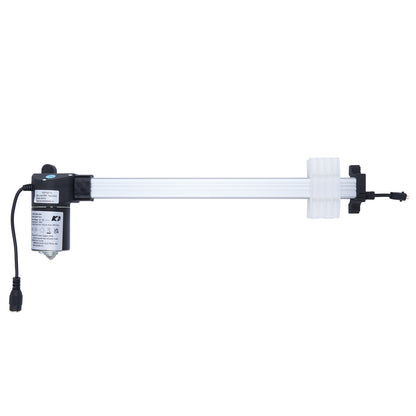 Long white mechanical device with black components on a white background