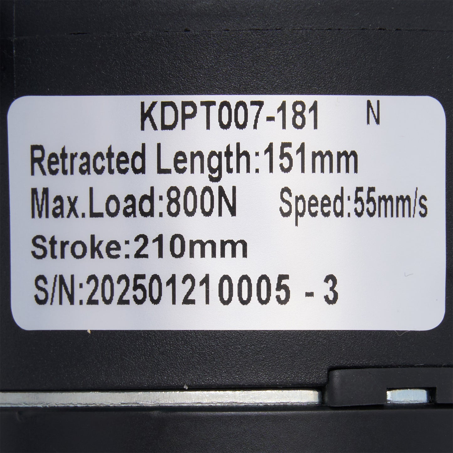 Technical specifications label on a black mechanical component