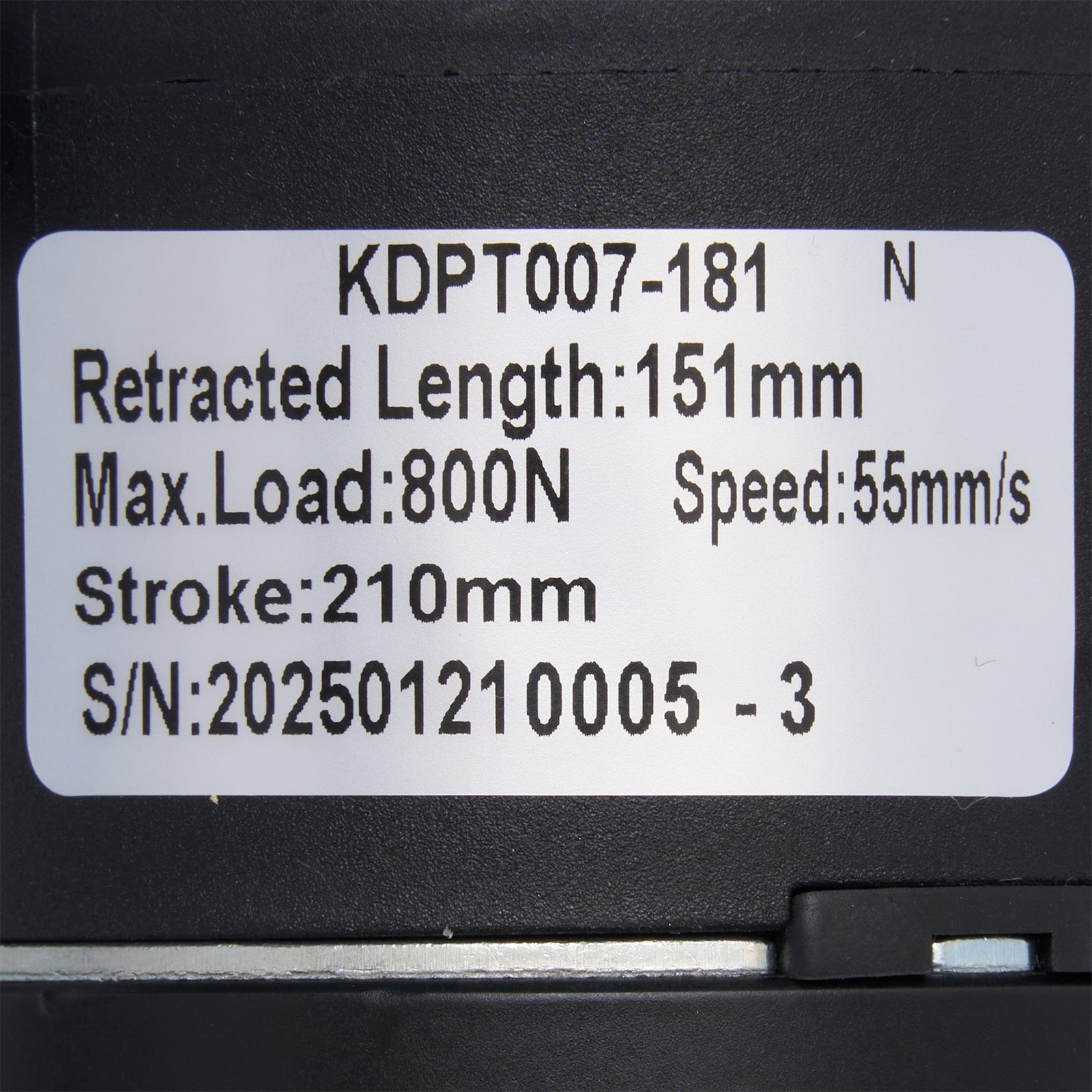 Technical specifications label on a black mechanical component